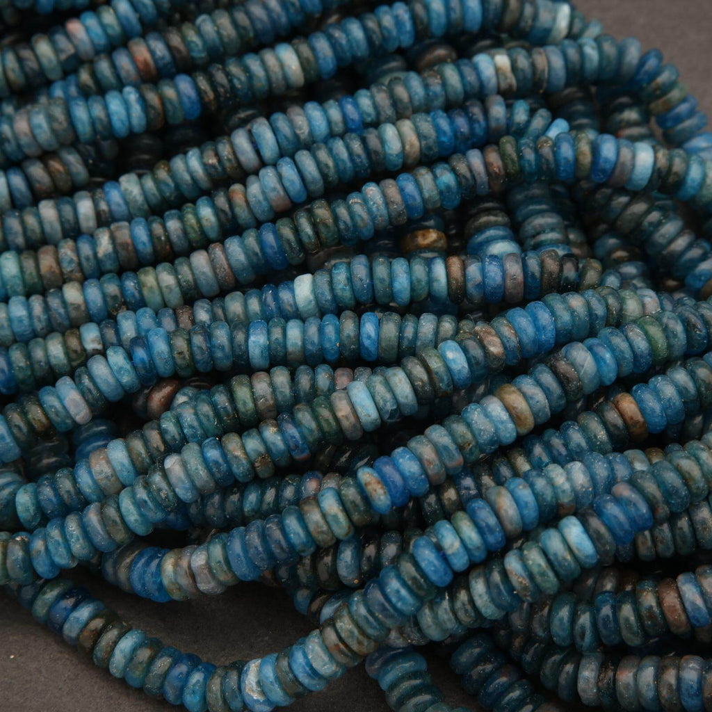 Close-up of a string of blue beads on a dark background