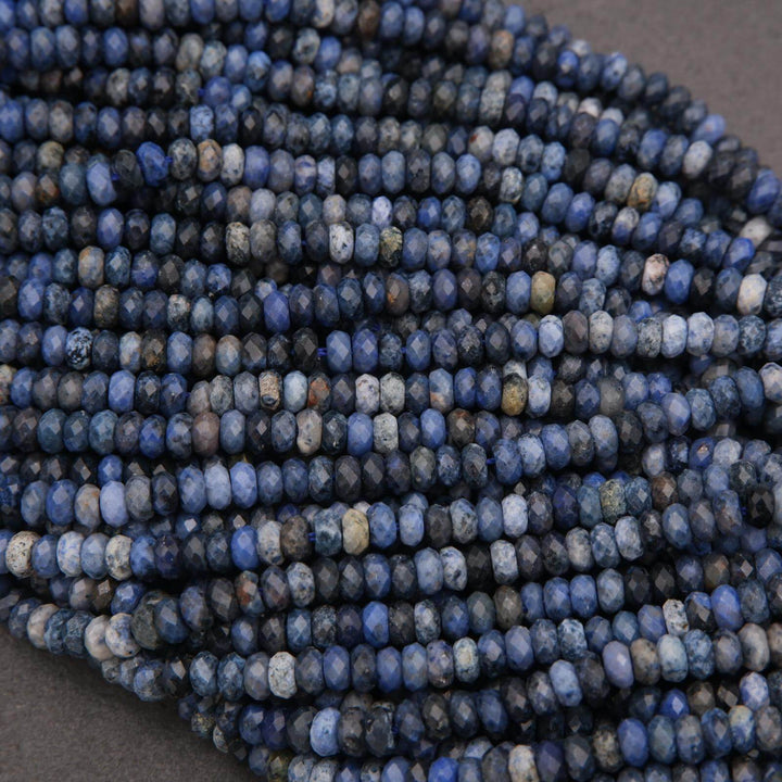 Close-up of a string of blue beads on a dark background