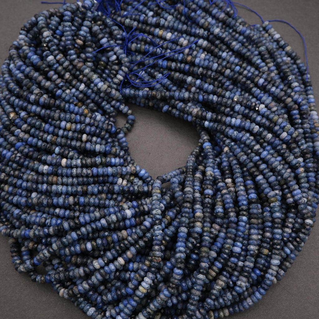 String of blue beads on a gray background