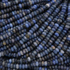 Close-up of blue beads arranged in a pattern