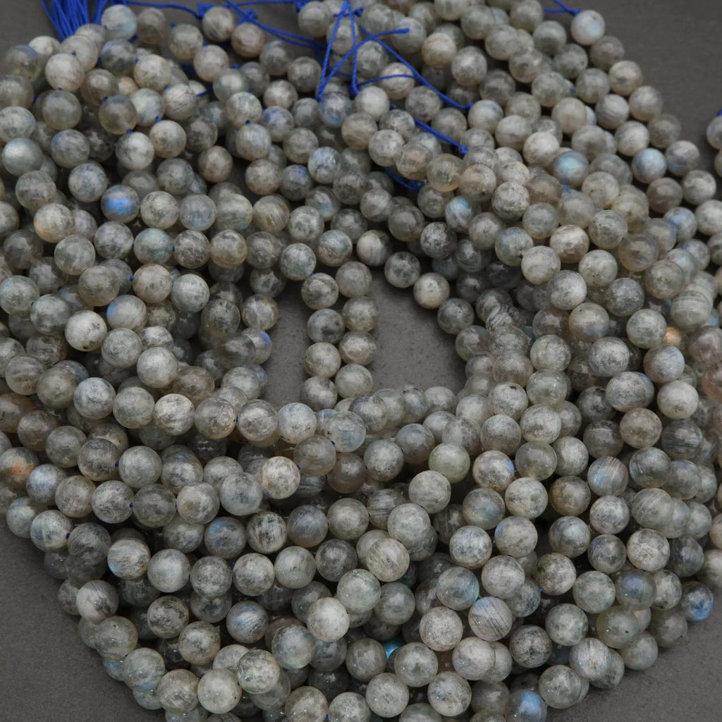 String of round beads on a gray background
