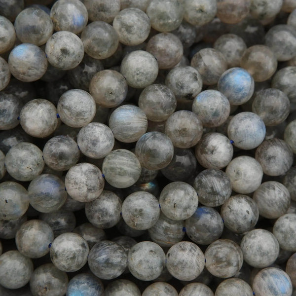 Close-up of grayish-beige spherical beads.