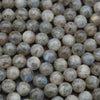 Close-up of grayish-beige beads with a slight sheen.