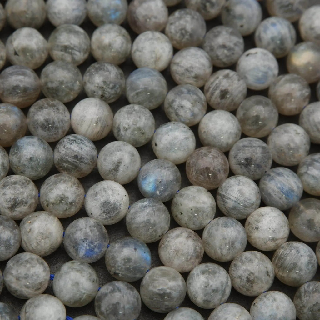 Close-up of grayish-beige beads with a slight sheen.