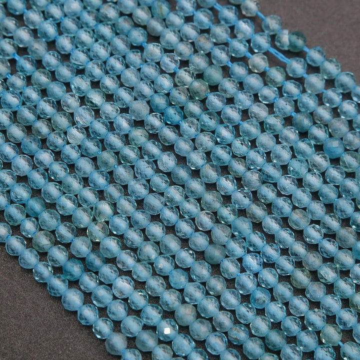 Close-up of a string of blue beads on a dark background