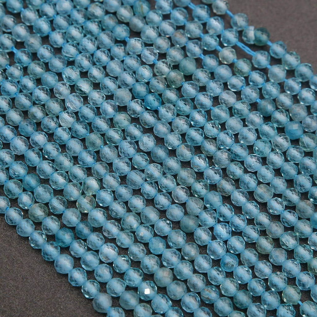 Close-up of a string of blue beads on a dark background