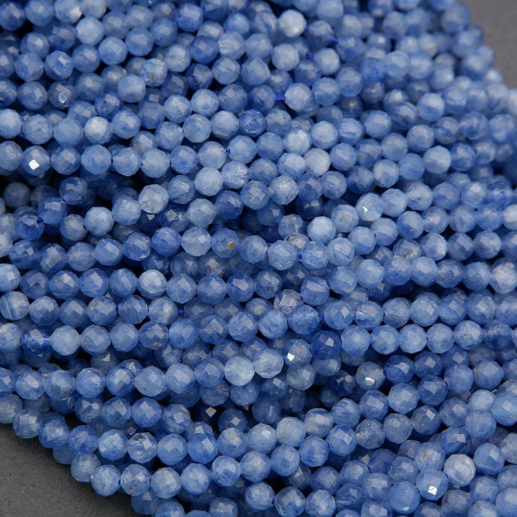 Close-up of blue faceted beads on a dark background
