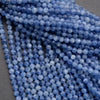 Close-up of blue beads on a dark background