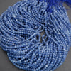 String of blue beads on a gray background