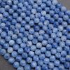 Close-up of blue faceted beads on a dark background