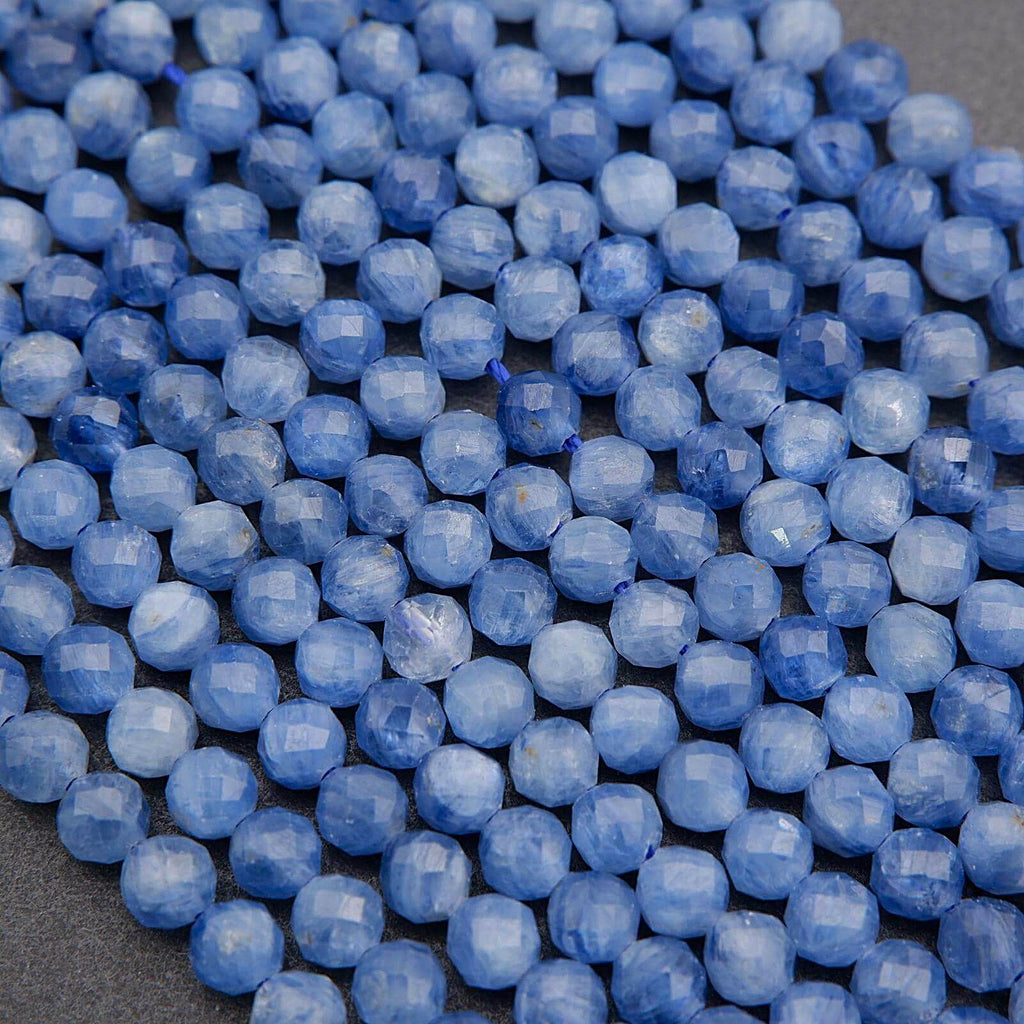 Close-up of blue faceted beads on a dark background