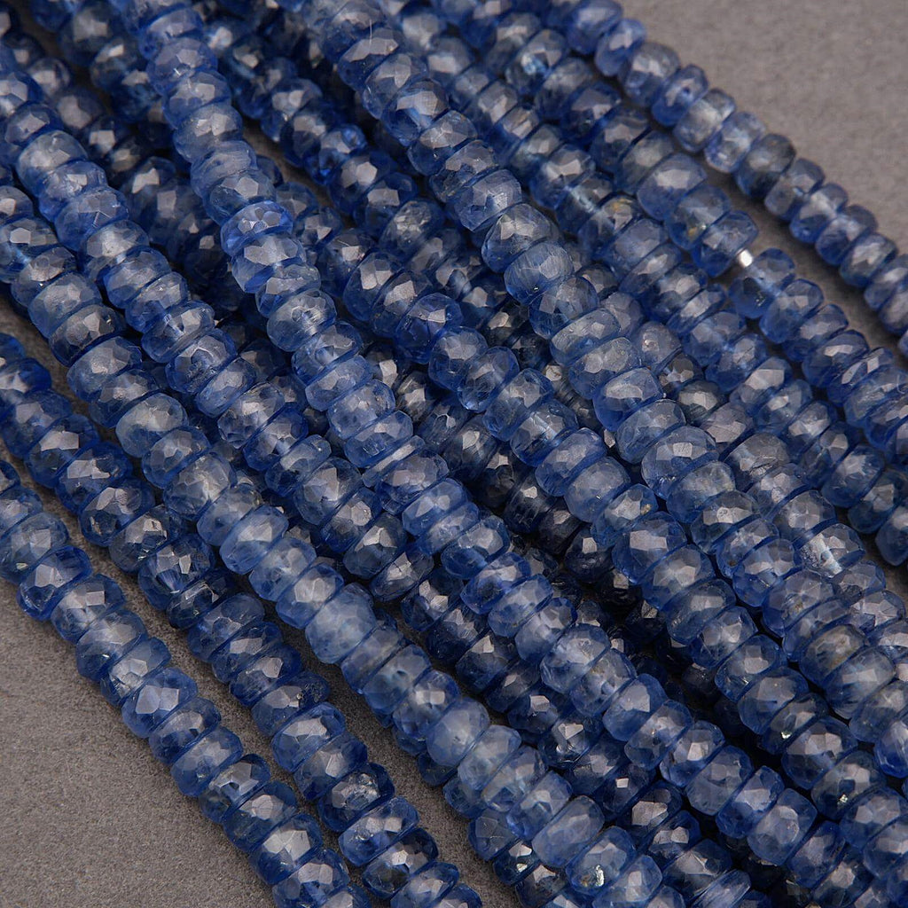 Close-up of blue faceted beads on a gray background