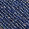 Close-up of blue glass beads on a gray background