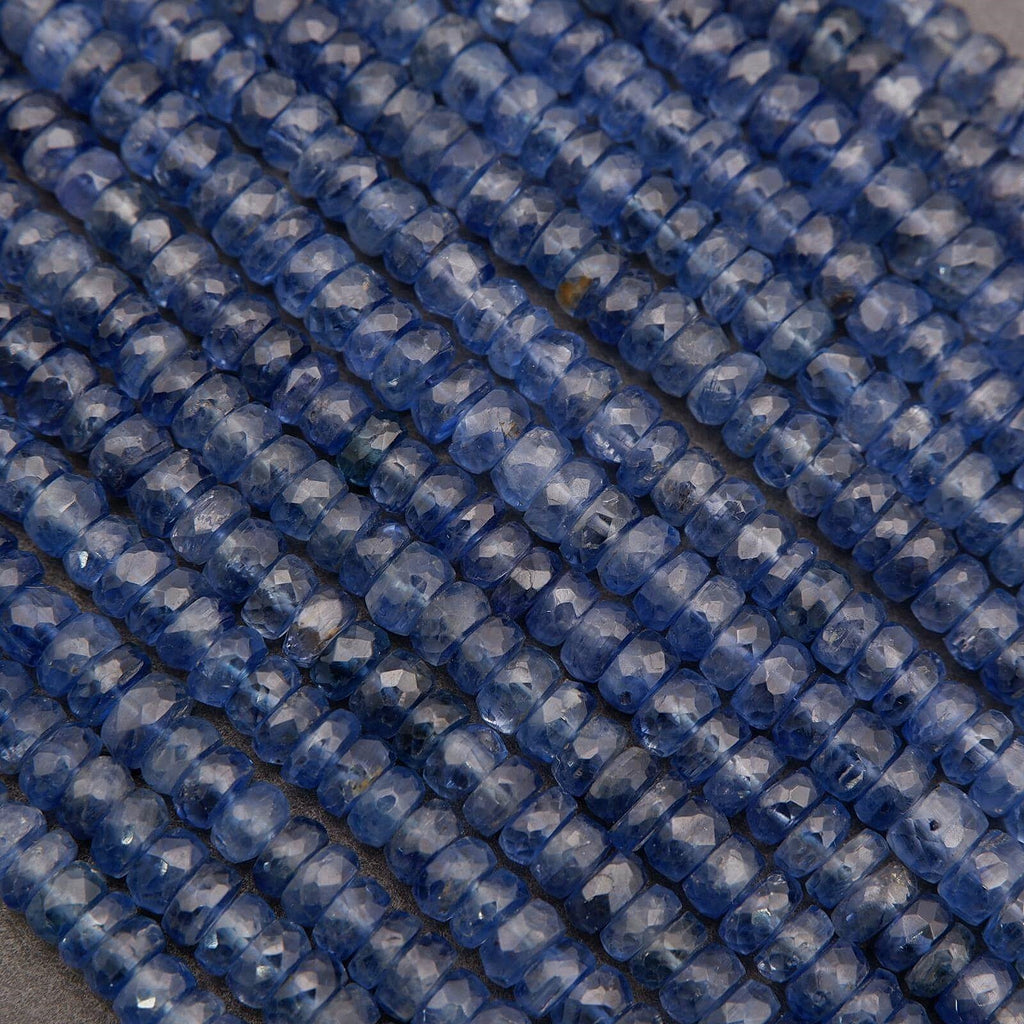 Close-up of blue glass beads on a gray background
