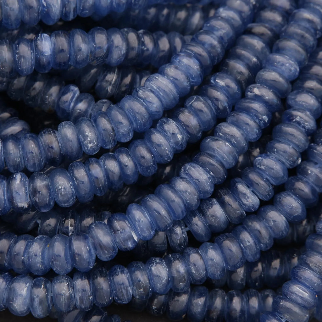 Close-up of blue kyanite beads stacked together