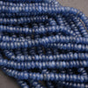 Close-up of blue beads on a gray background
