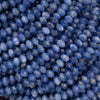 Faceted blue kyanite rondelle beads with rich denim-blue color and natural silky striations.