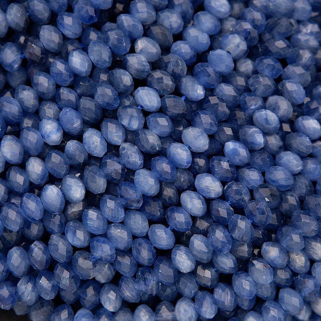 Faceted blue kyanite rondelle beads with rich denim-blue color and natural silky striations.