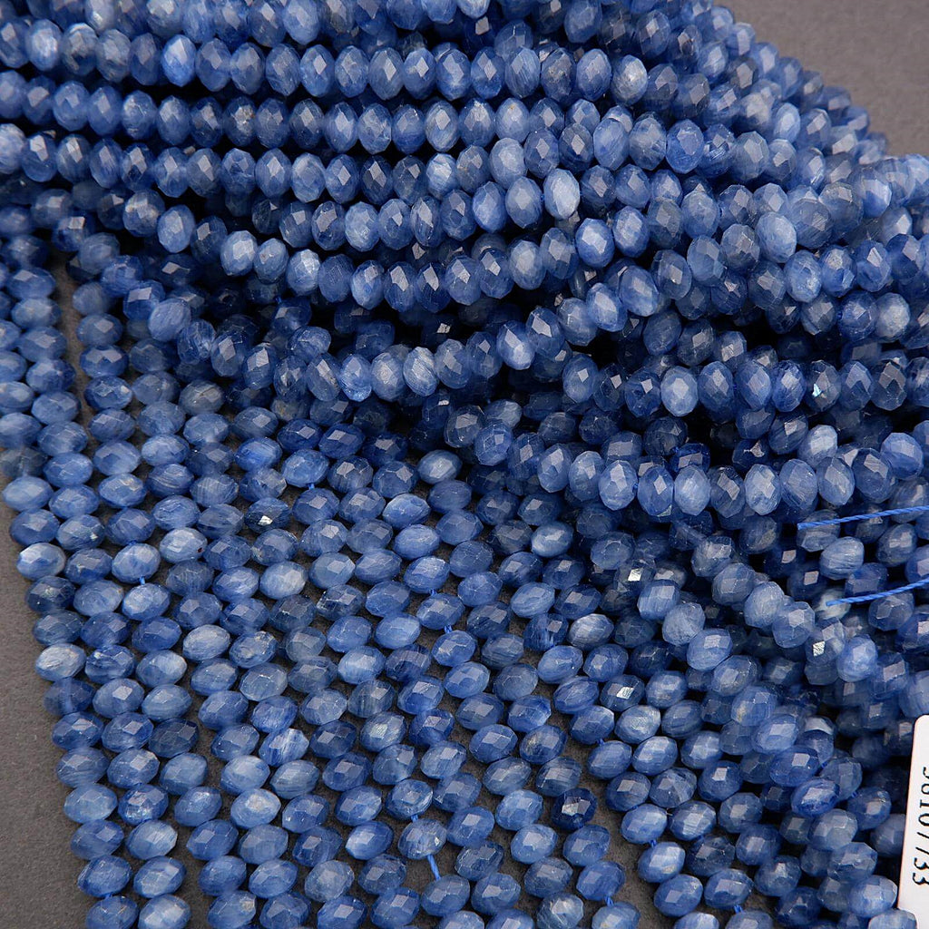 Multiple strands of faceted blue kyanite rondelles featuring natural color variation and shimmer.