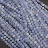 Close-up of blue and white spherical beads on a dark background
