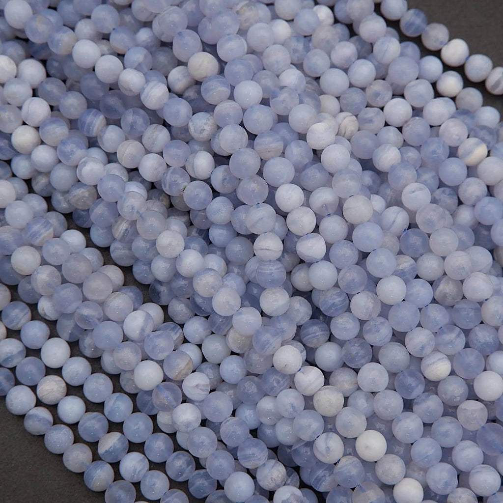 Close-up of blue and white spherical beads on a dark background