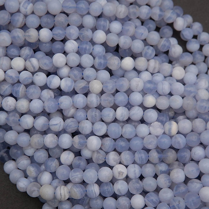Close-up of blue and white marbled beads.