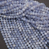 Close-up of blue and white spherical beads on a dark background