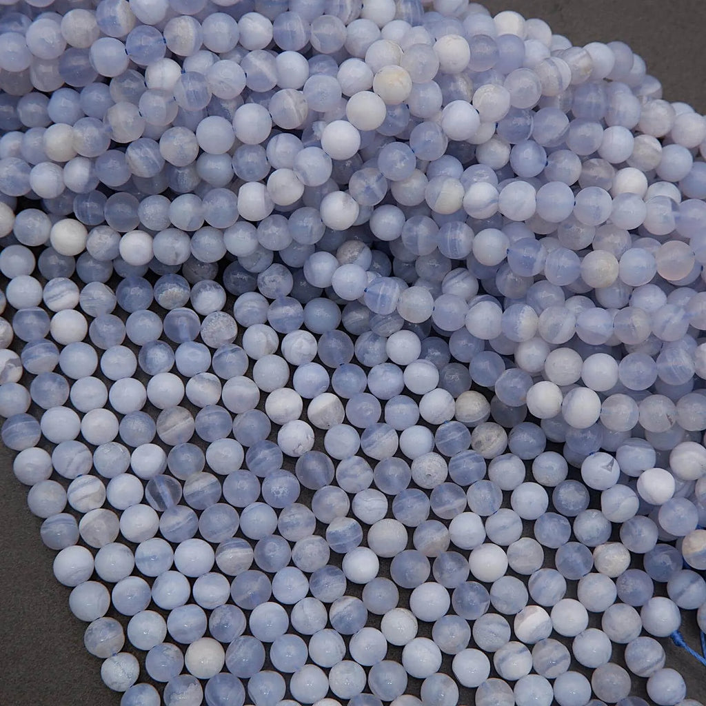 Close-up of blue and white spherical beads on a dark background