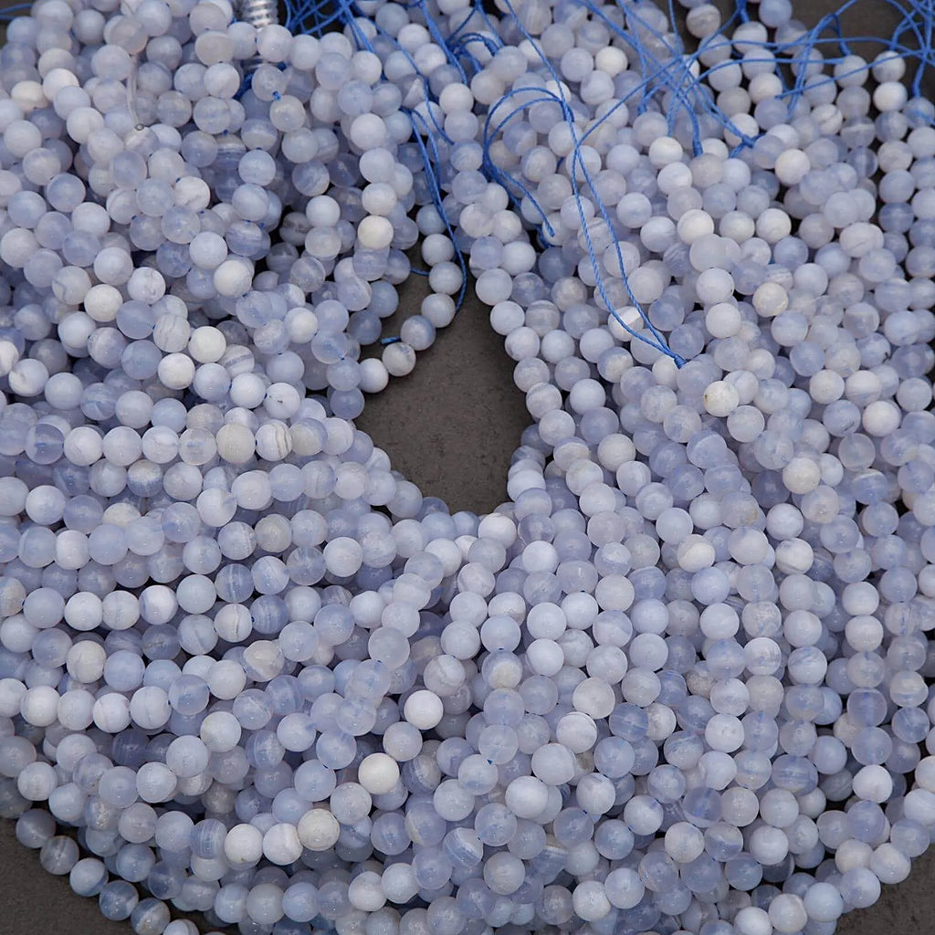 Close-up of blue and white beads on a string