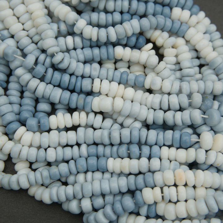 Smooth blue and white stone rondelle beads close up