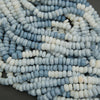 Smooth blue and white stone rondelle beads close up