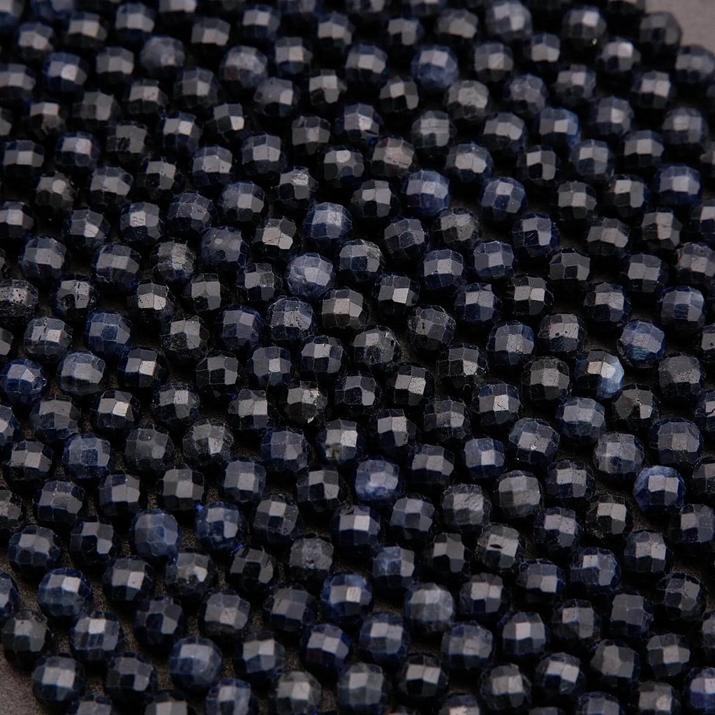 Close-up of dark blue beads arranged in a pattern