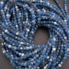 String of blue and white beads on a dark background