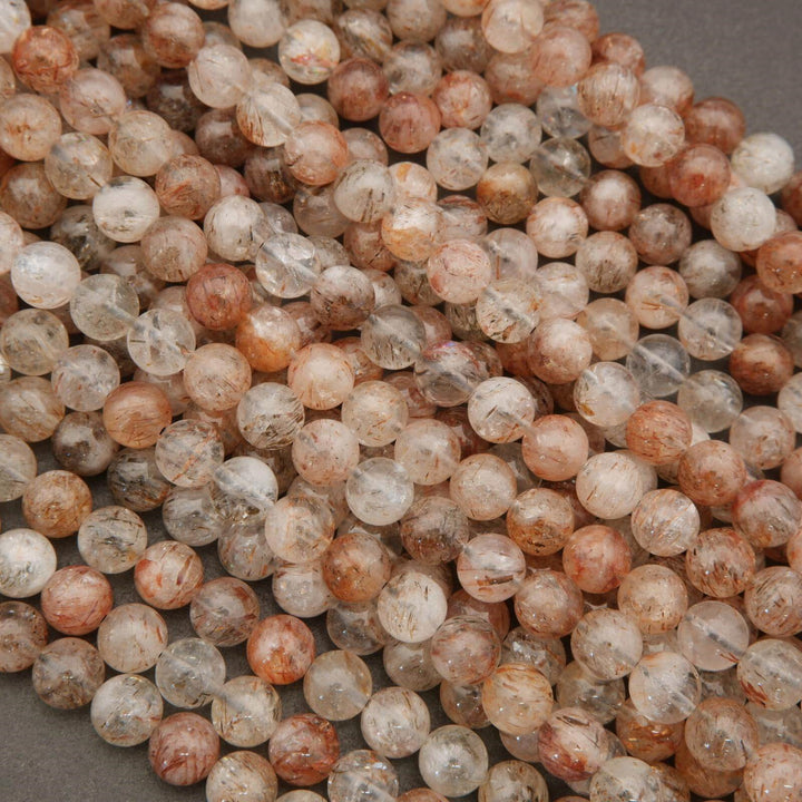 Close-up of multicolored beads on a gray background