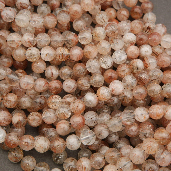 Close-up of round, beige-colored beads.