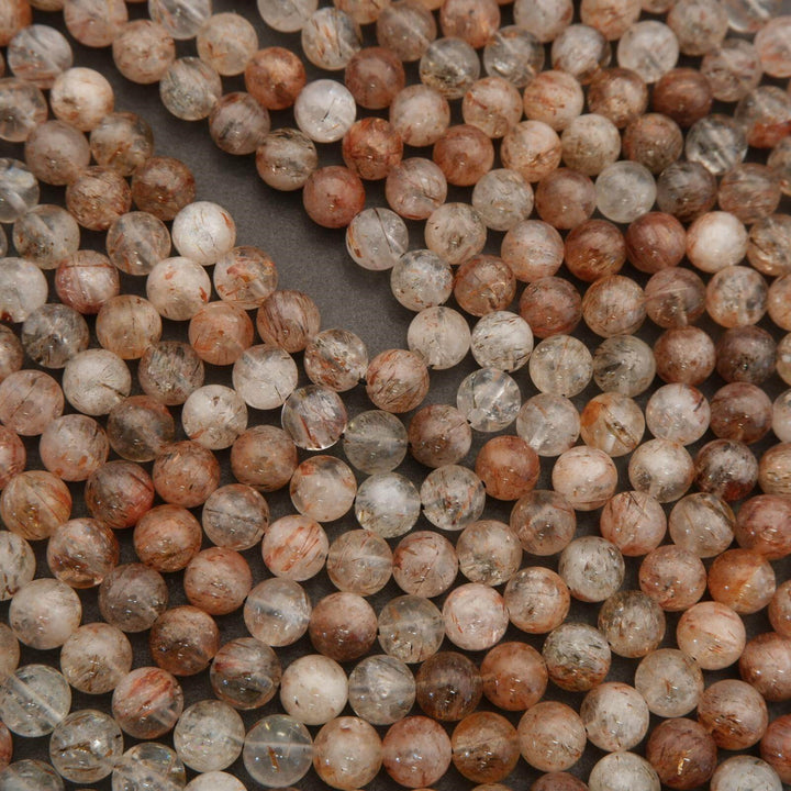Close-up of multicolored round beads on a dark background