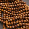Close-up of brown beads on a dark background