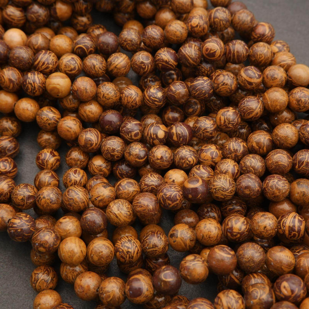 Close-up of brown beads on a dark background