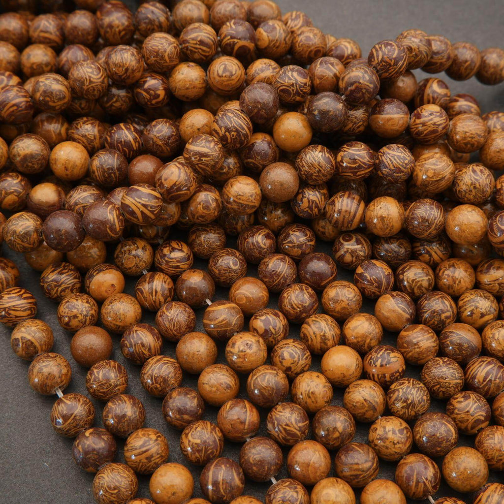 Close-up of brown wooden beads on a dark surface