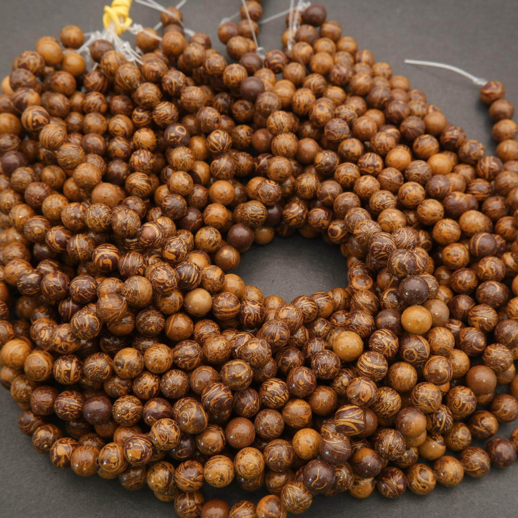Close-up of a string of brown beads on a dark background