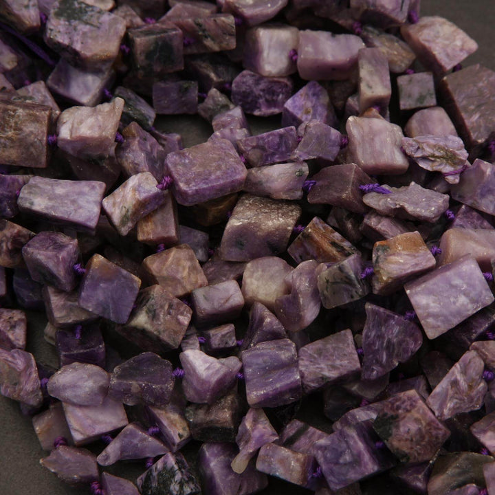 Close-up of purple and brown stone chips on a dark background