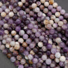Close-up of multicolored round beads on a gray background