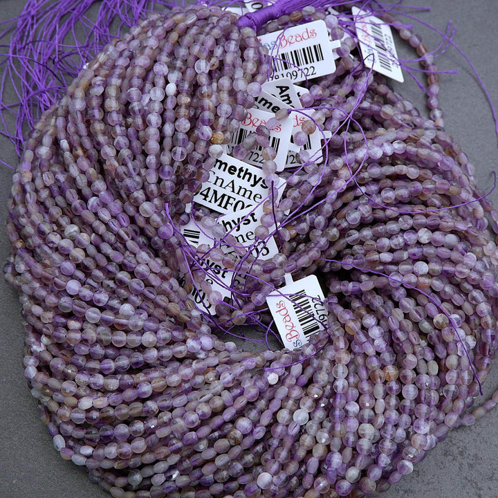 Purple beaded string with multiple labels on a gray background