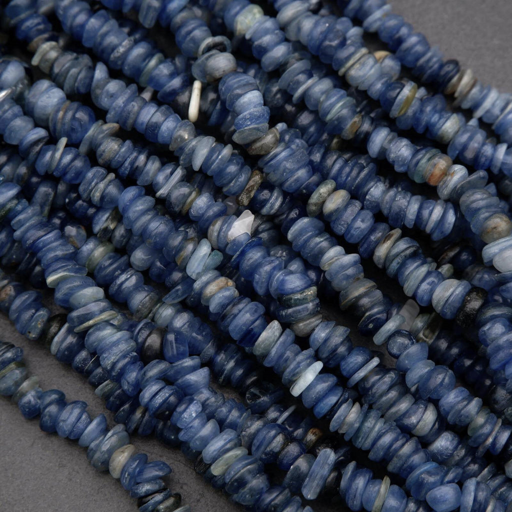 Close-up of blue stone beads on a gray background