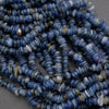 Close-up of a string of blue beads on a gray background