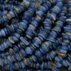 Close-up of blue glass beads with a textured surface