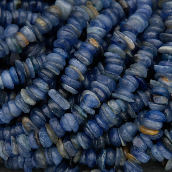Close-up of blue glass beads with a textured surface