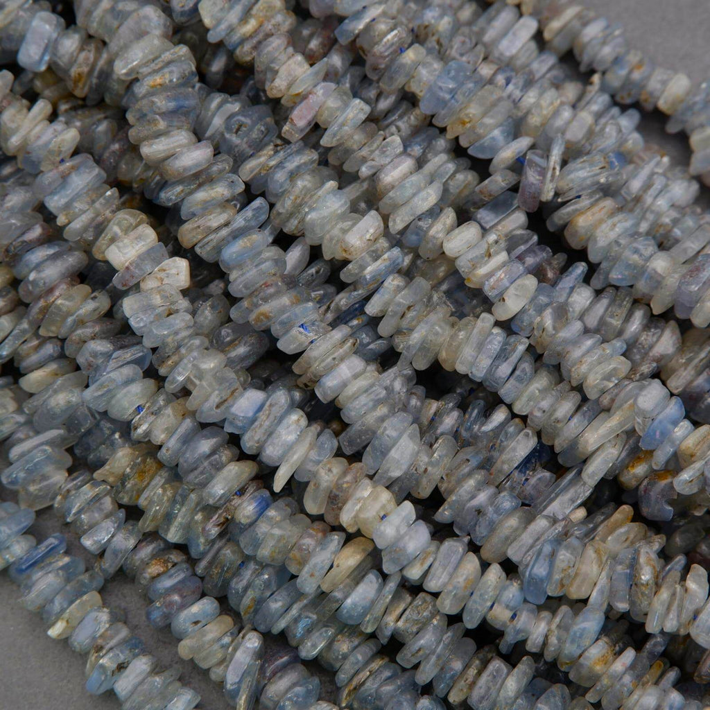 Close-up of blue stone beads on a gray background