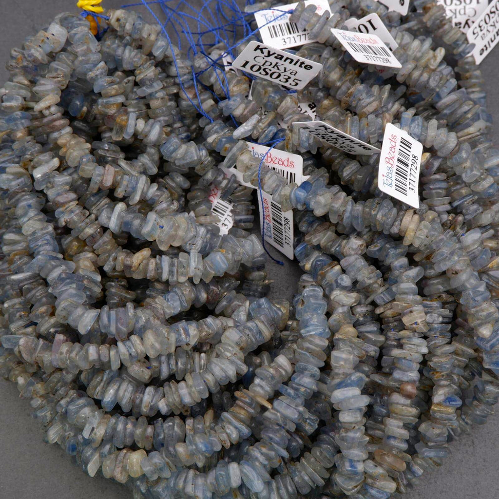 String of blue beads with price tags on a gray background