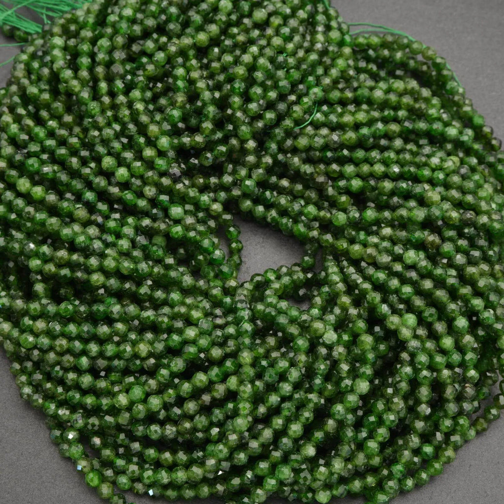Green beaded string on a gray background